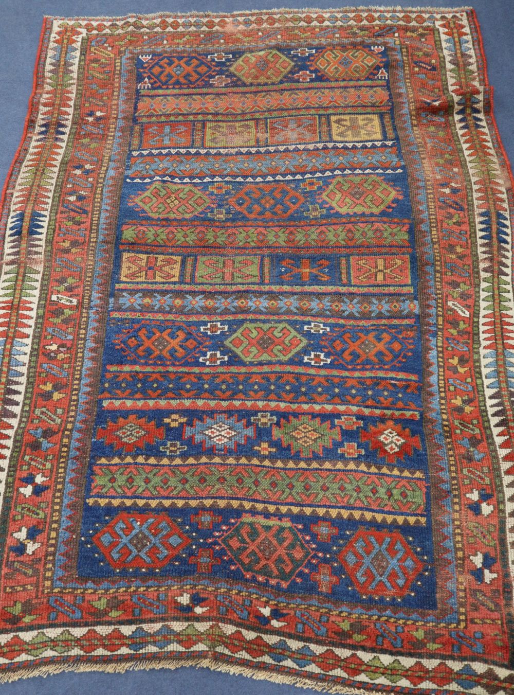 A red Kurdish rug, 206 x 140cm